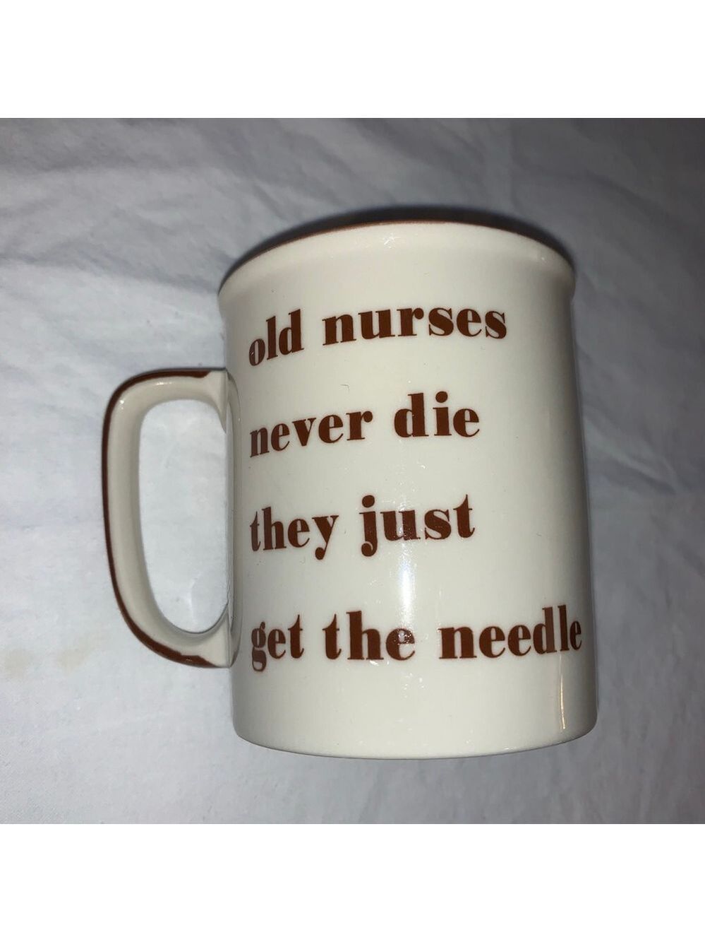 Cream Brown 'Old Nurses Never Die' Novelty Mug One Size